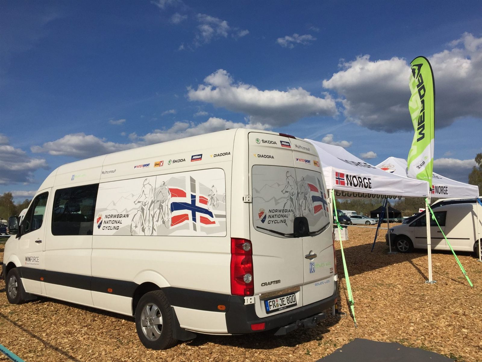 Team vehicle (VW Crafter) with Norwegian National Cycling livery and NORGE tent in the paddock